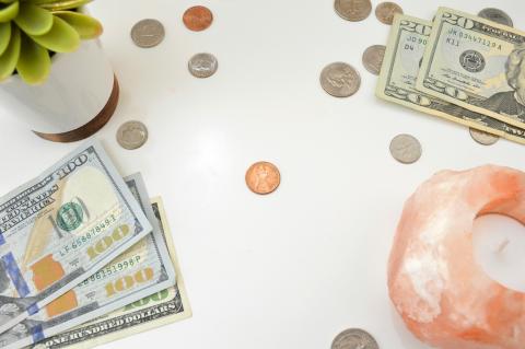 10 us dollar bill and coins by Katie Harp courtesy of Unsplash.