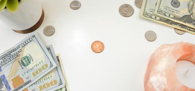 10 us dollar bill and coins by Katie Harp courtesy of Unsplash.